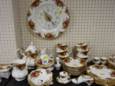 Good large parcel of Royal Albert 'Old Country Roses' tea and breakfast ware and a wall clock etc