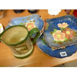 Three Royal Doulton floral plates, two oblong, one circular and an oval Royal Doulton transfer jug