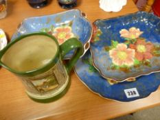 Three Royal Doulton floral plates, two oblong, one circular and an oval Royal Doulton transfer jug