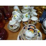 Three patterns of part teasets and a Wade gilt fifteen piece coffee service