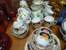 Three patterns of part teasets and a Wade gilt fifteen piece coffee service