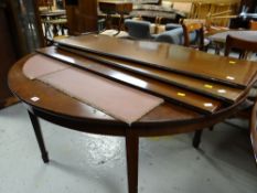 An antique extending D-end dining table