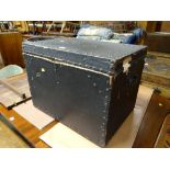 A vintage studded pine twin-handled cabin trunk