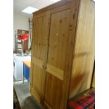 A two-door pine wardrobe