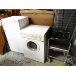 A retro wheelchair, a Philco self condensing washer dryer, a retro Electrolux freezer