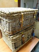 A pair of vintage wicker laundry baskets