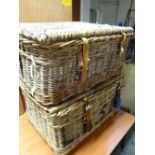 A pair of vintage wicker laundry baskets