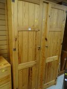 A pine two-door wardrobe