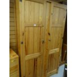 A pine two-door wardrobe