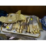 A tray of various flatware