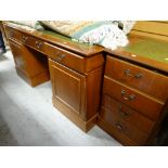 A reproduction pedestal computer desk with tooled leather top & matching filing cabinet