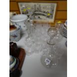 Two decanters, various cut glass drinking glasses, glass candlesticks etc