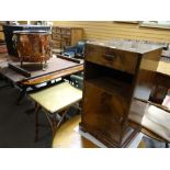 A wicker square topped bathroom table & a polished night cabinet