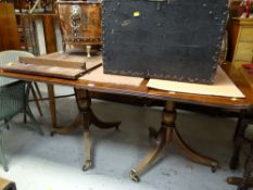 A good twin-pedestal mahogany dining table with extension leaf