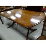 A reproduction twin-pedestal dining table
