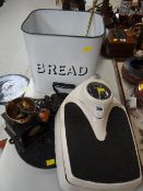 A vintage enamel bread bin, a vintage set of bathroom scales, coffee mill etc