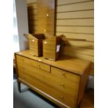 An A.Younger Ltd chest of two long & three short drawers together with a matching headboard with