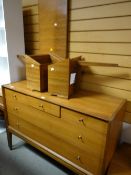 An A.Younger Ltd chest of two long & three short drawers together with a matching headboard with