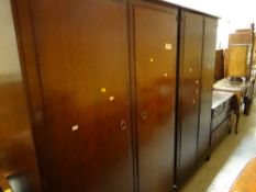 A suite of Stag Minstrel bedroom furniture comprising chest & two double wardrobes