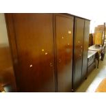 A suite of Stag Minstrel bedroom furniture comprising chest & two double wardrobes