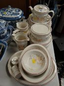 A quantity of Wedgwood peach pattern oven to table dinnerware