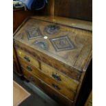 An antique carved oak sloped bureau with two long & two short drawers (for restoration)