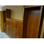 A reproduction library unit with flanking bookcases & centre cupboards