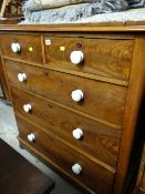 A Victorian mahogany chest of three long & two short drawers with ceramic knobs