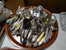 A tray of various flatware