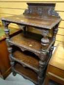 A turn of the century carved oak open dumbwaiter