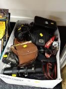 A quantity of photographic equipment including vintage Canon cameras & lenses etc