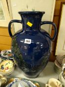 A large twin-handled continental glazed vase / urn