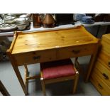A pine two-drawer dressing table & stool