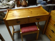 A pine two-drawer dressing table & stool
