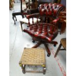 A reproduction buttoned leather captain-style swivel office chair together with a rush topped stool