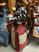 A golf bag & a set of ladies clubs