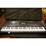 Casio CTK-3000 electronic keyboard in a carry case