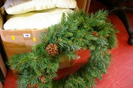 Box containing artificial Christmas wreath and a quantity of scatter cushions