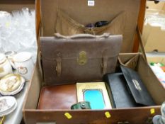 Vintage leather suitcase with mixed contents including vanity sets, satchel etc