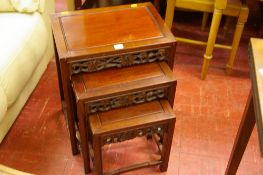 Nest of three carved Chinese hard wood side tables