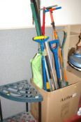 Quantity of long handled garden tools and a storage stand