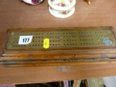 Brass and wood cribbage board with accompanying playing cards