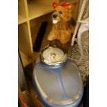 Stylish set of bathroom scales, small stool and a dog garden ornament