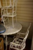 Cast metal garden table and four chairs