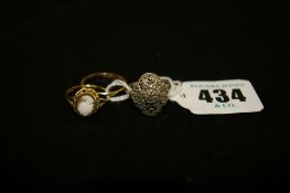 Nine carat gold oval cameo ring and a wedding band, 2.6 grms gross with a silver and floral