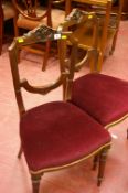 Pair of Victorian side chairs with upholstered seats and carved decoration