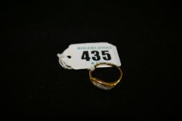 Gold dress ring with five tiny diamonds, 2.2 grms gross, marks worn