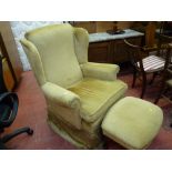Classical reproduction wingback armchair with matching footstool