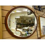 Oval mahogany framed bevelled wall mirror