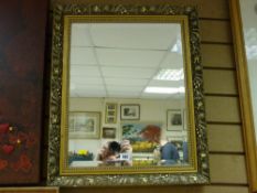 Gilt framed bevelled wall mirror